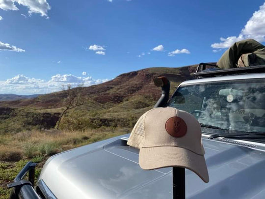 Truckers Hat In Dogs We Trust logo